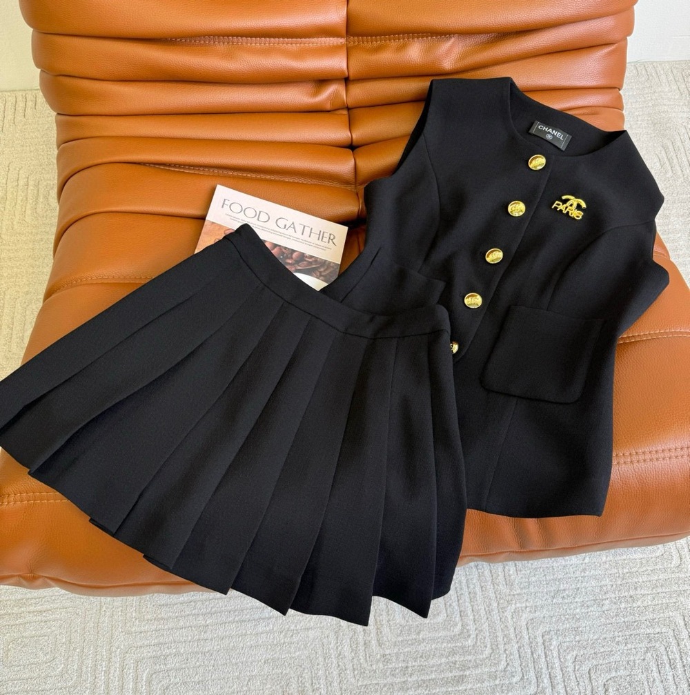 Chanel black sleeveless top and short skirt set